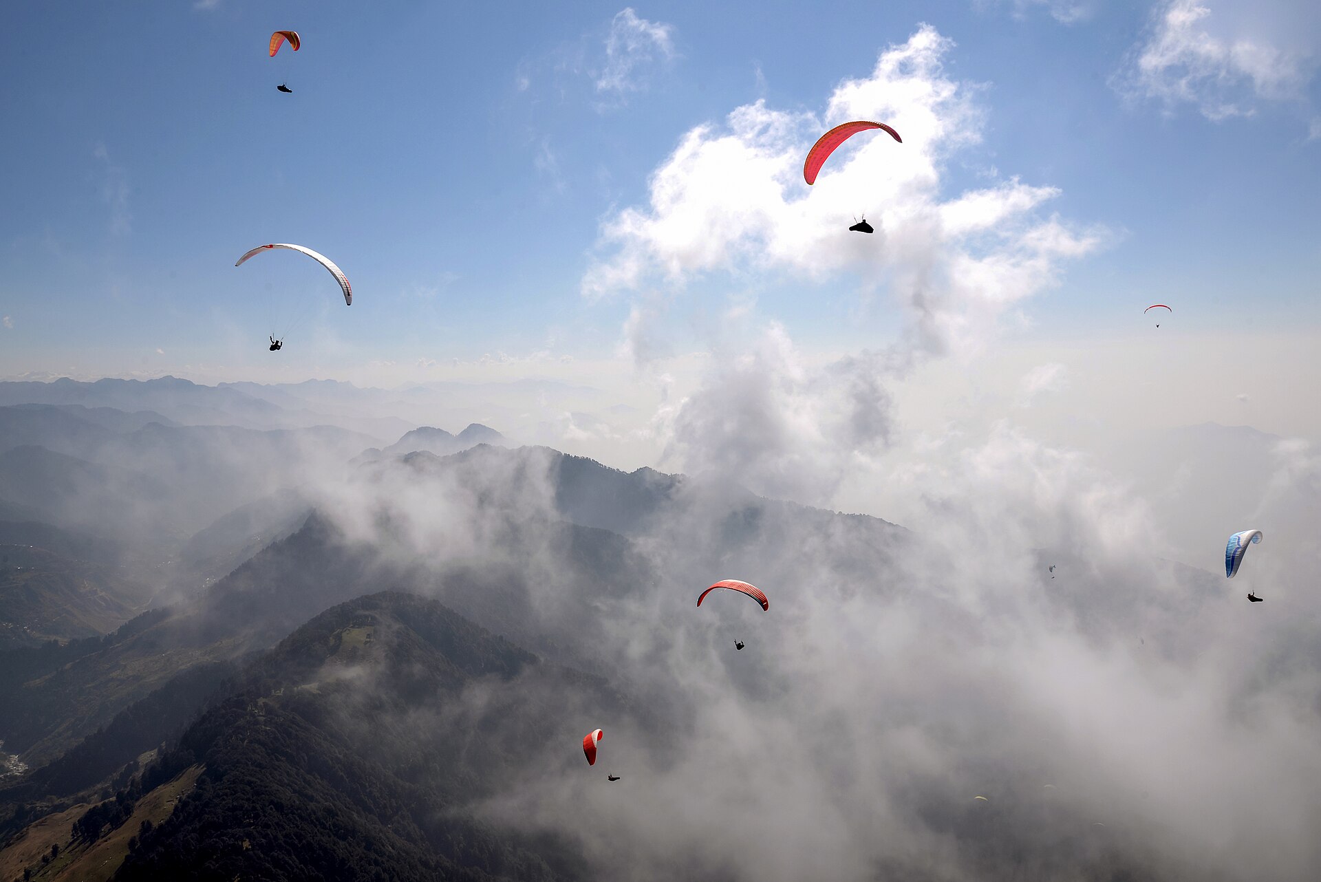 Paragliders soaring above Bir Billing, Himachal Pradesh